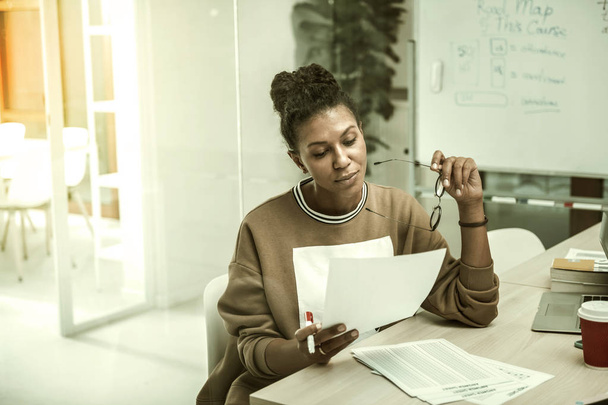 African-American office worker feeling busy preparing her speech - 写真・画像