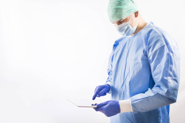 Working surgeon in a hospital operating room - Fotó, kép