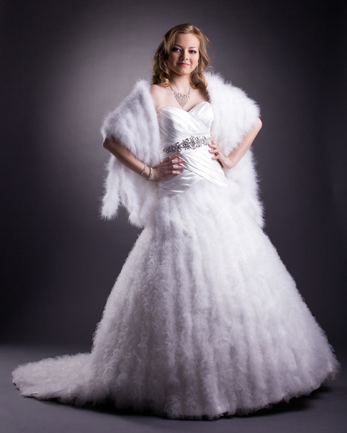 Pretty woman posing in luxurious wedding dress - Zdjęcie, obraz