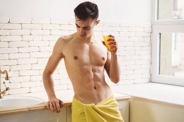 morning routine, fit man starting day with  juice - Fotó, kép