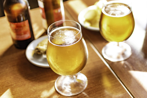 Cold beer glasses with delicious tapas to enjoy among friends. - Photo, Image