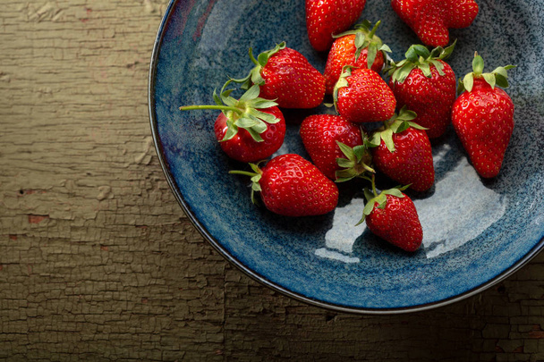 Fresh strawberry on plate above - Фото, зображення
