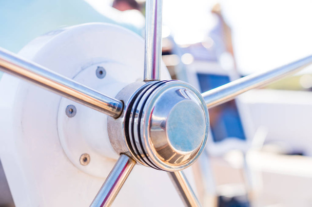 Detail of modern sailing yacht steering wheel. Leasure activities and extreme sport. Low depth of focus. - Photo, Image