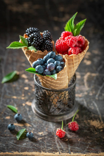 Juicy berry fruits in waffels as homemade ice cream - Foto, afbeelding
