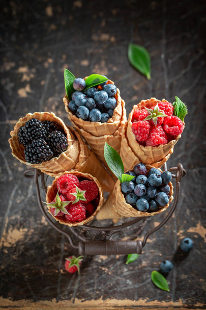 Sweet berries in waffels as homemade ice cream - Foto, afbeelding