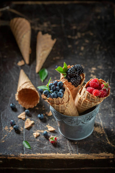 Delicious berry fruits in waffels as concept of ice cream - Фото, изображение