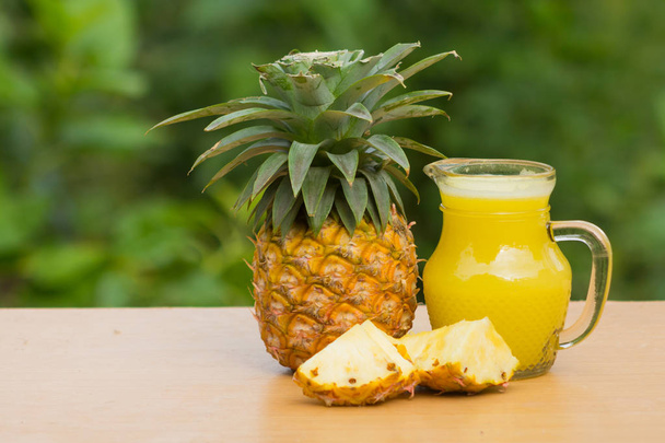 Pineapple juice has medicinal properties help digestion. Reduce appetite. Dissolve urine and reduce hot sores in mouth. - Valokuva, kuva