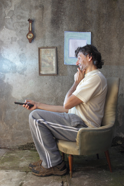Crying man with remote control - Valokuva, kuva