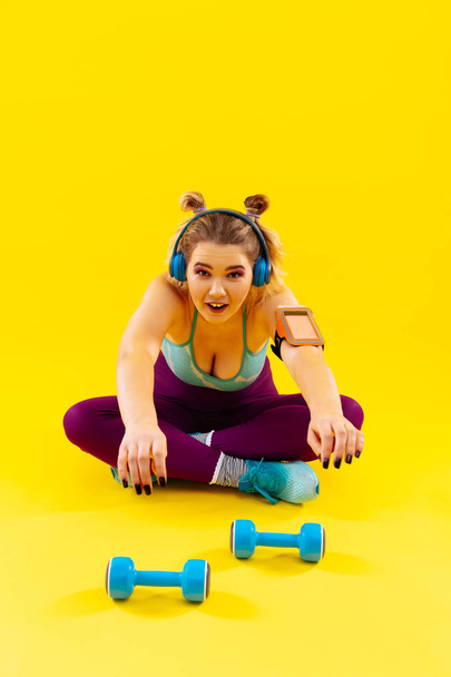 Woman loving weights feeling tired after exercising in the morning - Фото, зображення