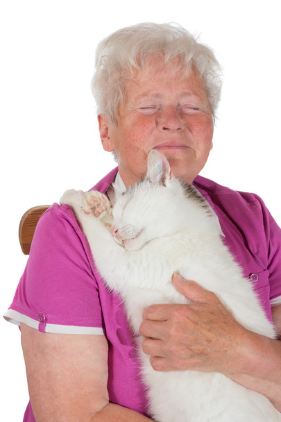 Pensionato abbracciare il suo gatto bianco
 - Foto, immagini