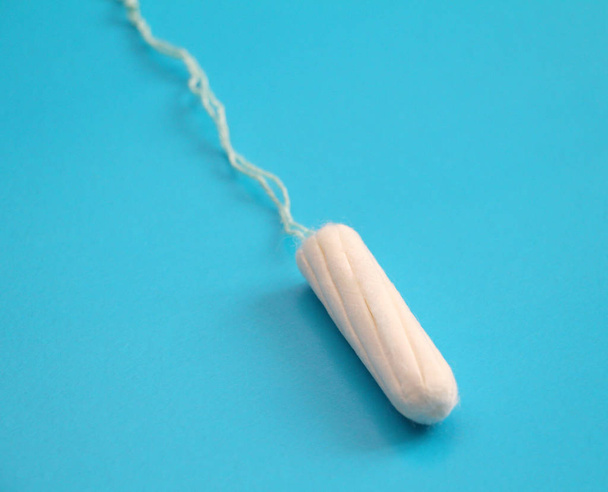 One hygienic tampon. Feminine hygiene, personal care. Critical days of women. Menstruation. Medical gynecological subject. - Foto, imagen