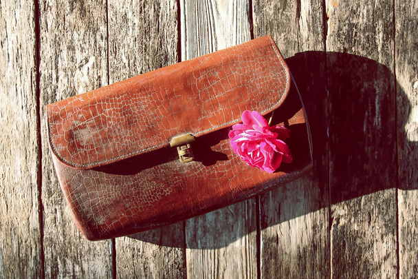 Old leather vintage reticule bag with rose. - Φωτογραφία, εικόνα