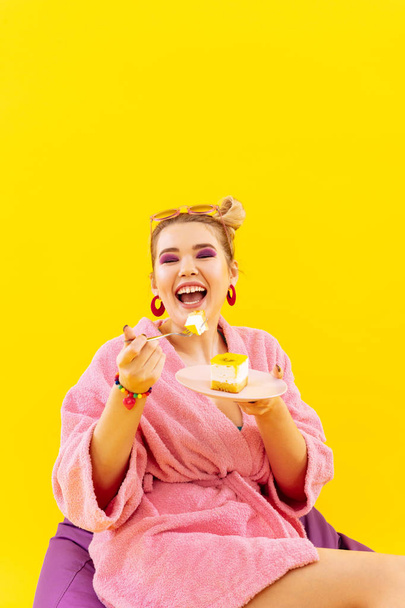 Woman having some overweight eating sweet fruit cake - Foto, imagen