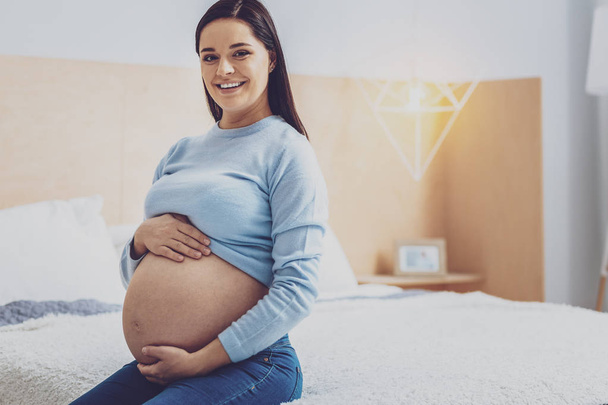 Pretty female person expecting baby - Photo, Image