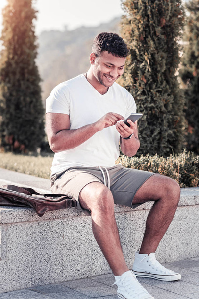 Delighted male person typing message - Foto, immagini