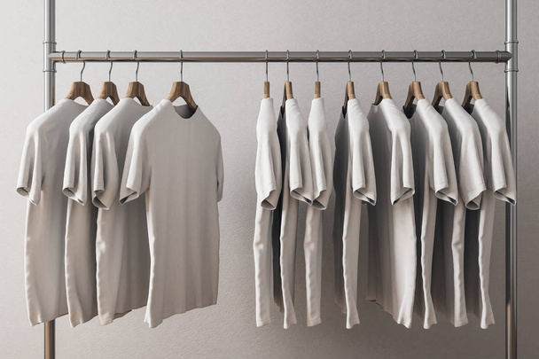 Row of white tshirts on hangers. Concrete wall background. Style and design concept. 3D Rendering  - Fotografie, Obrázek