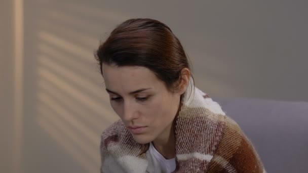 Sick depressed woman covered with plaid suffering loneliness in hospice, disease - Materiał filmowy, wideo