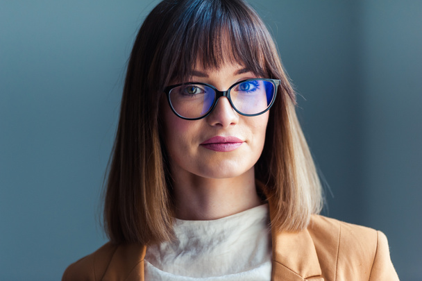 Portrait of beautiful young woman in eyeglasses - Photo, Image
