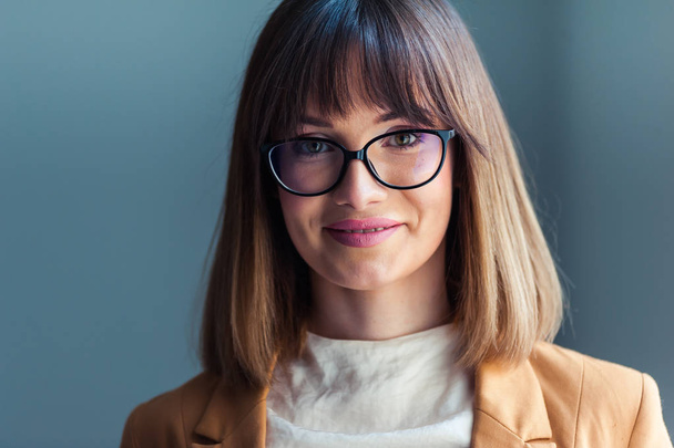 Portrait of beautiful young woman in eyeglasses - Photo, Image