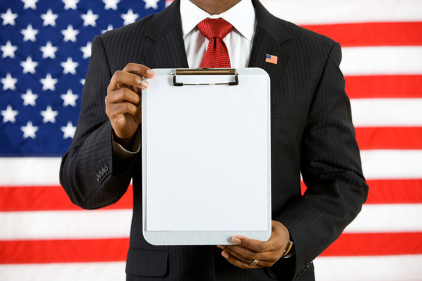 Politician: Holding Up a Clipboard with Blank Paper - Foto, imagen
