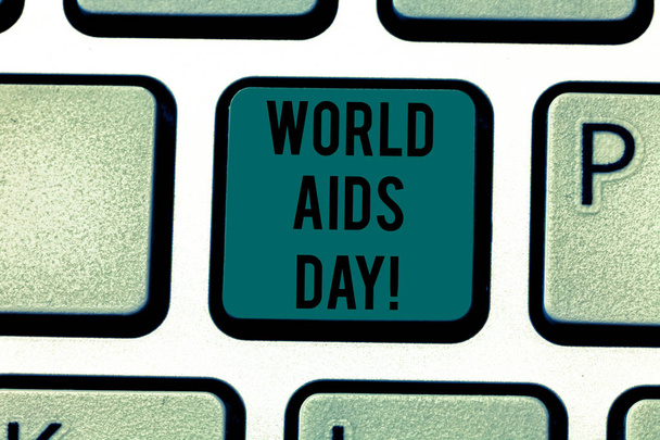 Εννοιολογική χέρι γραφή δείχνει την παγκόσμια ημέρα κατά του Aids. Επαγγελματίες φωτογραφία κείμενο 1η Δεκεμβρίου αφιερωμένο στην ευαισθητοποίηση για το Aids πληκτρολόγιο κλειδί πρόθεση να δημιουργήσετε υπολογιστή μήνυμα ιδέα. - Φωτογραφία, εικόνα