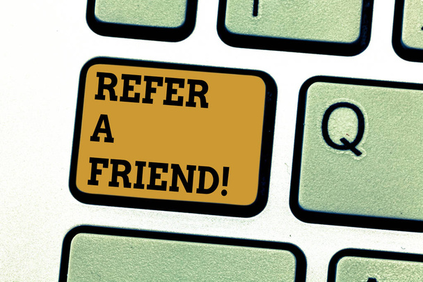 Text sign showing Refer A Friend. Conceptual photo Recommendation Appoint someone qualified for the task Keyboard key Intention to create computer message pressing keypad idea. - Photo, Image