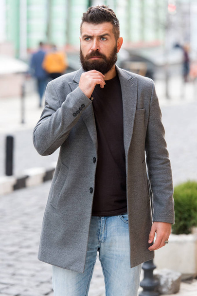 Taking time to think. Hipster in business style on street. Business man in modern city. Professional businessman leading busy lifestyle. Bearded man going to work. The beginning of working day - Foto, Imagem