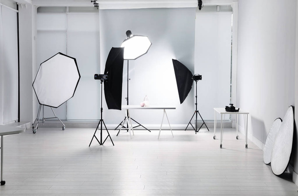 Interior of modern photo studio with professional equipment - Zdjęcie, obraz