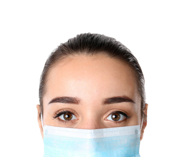 Young medical student with face mask on white background, closeup - Fotó, kép