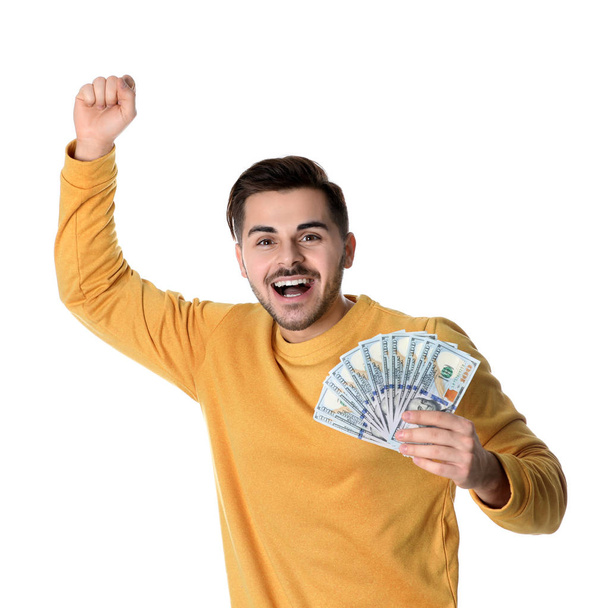 Portrait of happy young man with money on white background - Fotografie, Obrázek