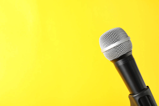 Dynamic microphone on color background, space for text - Zdjęcie, obraz