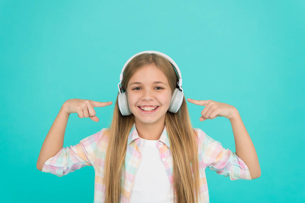 Learn song lyrics. Clear sound. Girl child listen music with modern headphones. Kid little girl listen music headphones. Music account playlist. Customize your music. Listen track for dancing - Fotó, kép