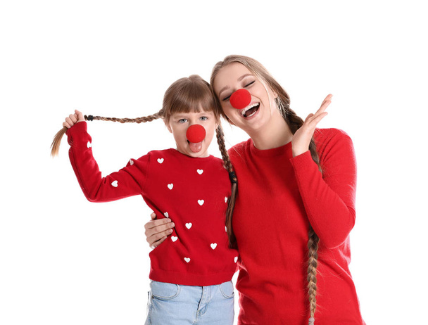 Happy woman and daughter with clown red noses on white background - Φωτογραφία, εικόνα
