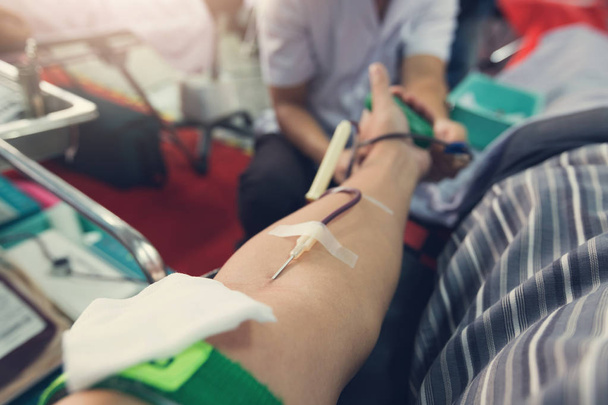 Nurse receiving blood from blood donor in hospital. - Foto, imagen