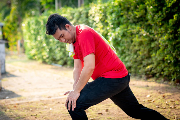 Happy Asian sport man doning exercise in the park outdoor. - Valokuva, kuva