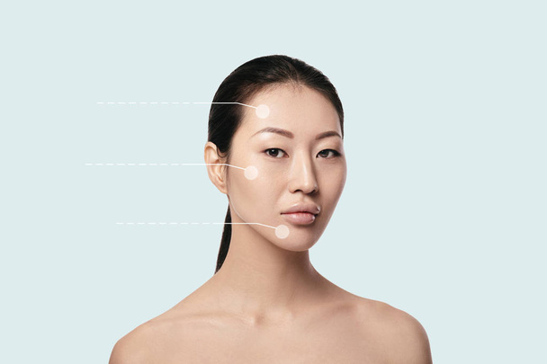 Asyalı genç, güzel ve doğal kadın yüzünde noktalı oklarla - Fotoğraf, Görsel