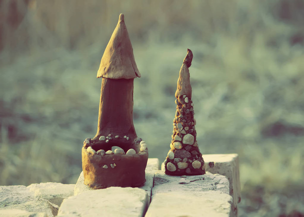 Homemade toy. Small castle made of clay and stones. - Photo, Image