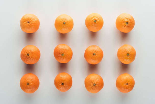 flat lay with bright ripe orange tangerines on white background - Photo, Image