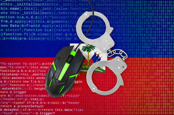 Haiti flag  and handcuffed modern backlit computer mouse. Creative concept of combating computer crime, hackers and piracy - Photo, Image