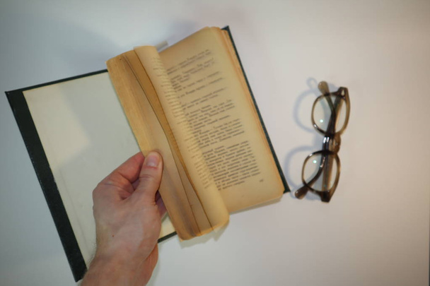 old book and glasses on white background - Foto, Imagem