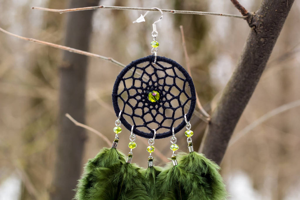 earrings of Dream catcher with feathers threads and beads rope hanging. Dreamcatcher handmade - Photo, Image