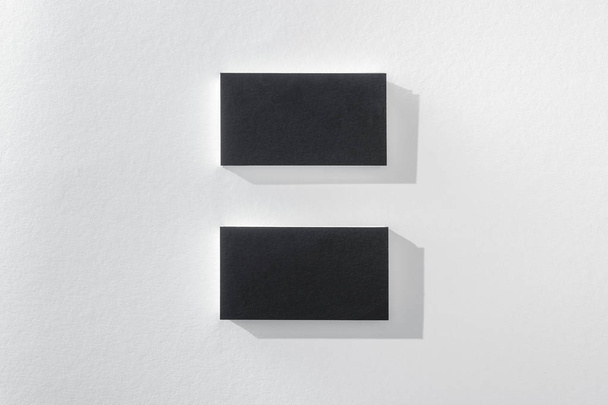 top view of black cards on white background with copy space - 写真・画像