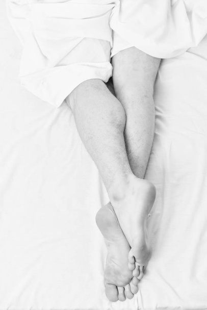 Stretch after wake up in the morning. Man stretching in bed. I wake up from sleep. - Fotografie, Obrázek