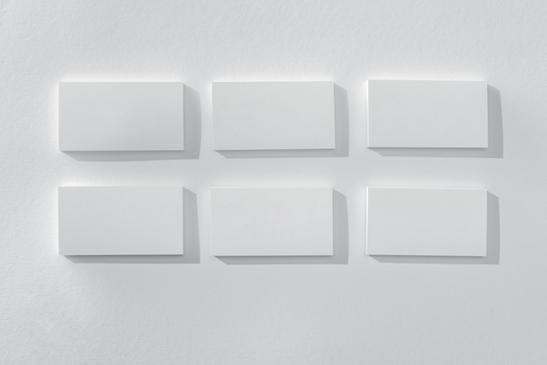top view of blank and empty cards on white background  - Фото, зображення