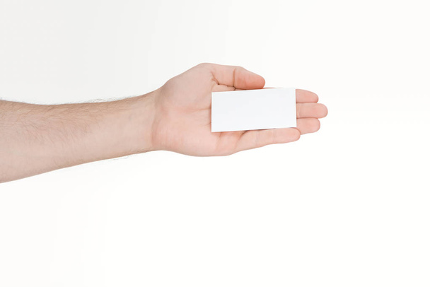 cropped view of man holding blank card on white background  - Valokuva, kuva