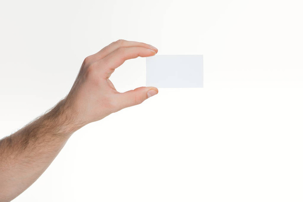 partial  view of man holding empty card on white background  - Zdjęcie, obraz