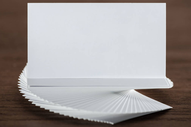 close up of empty and blank card on wooden table with copy space - Fotoğraf, Görsel