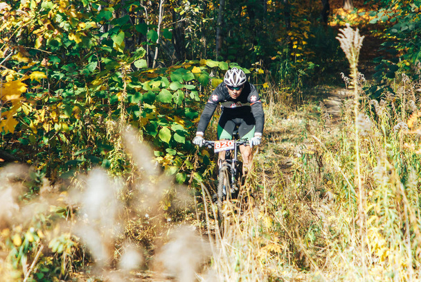 October 14, 2018 - Minsk, Belarus: 2018 Olympic Cross Country Cup XCO in Medvezhino, man riding mtb bicycle during race - Valokuva, kuva