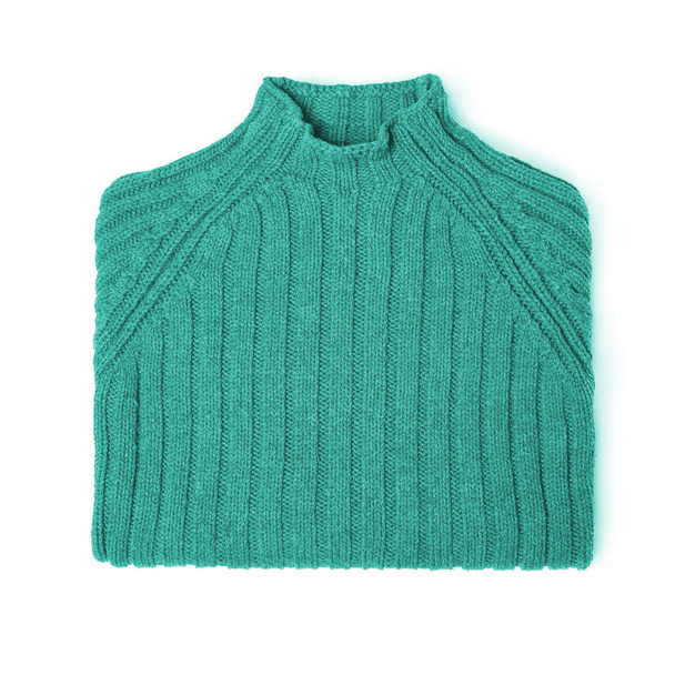 Colored wool neatly folded sweater on a white background. - Fotó, kép
