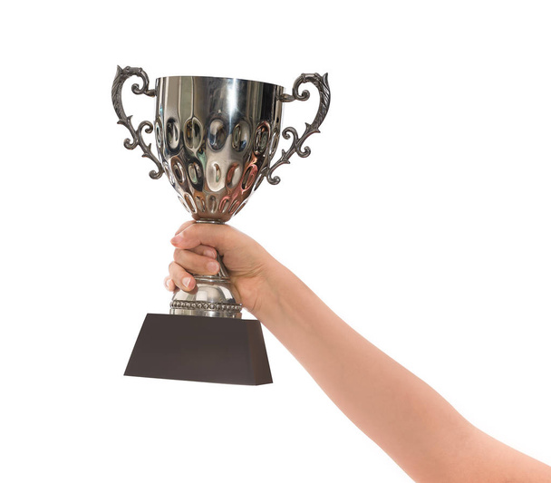 Woman holding a champion silver trophy isolated on white background with clipping path - Foto, afbeelding